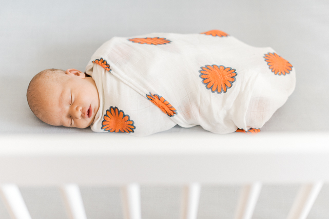 Baby Swaddled and Sleeping in a crib {Calgary Lifestyle Photographer}