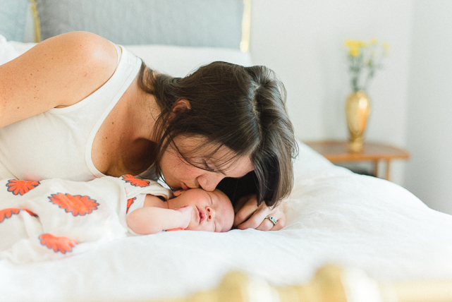 Mama Kisses her Newborn Baby {Calgary Family Photographer}