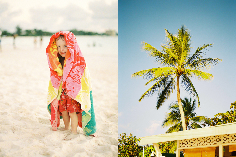 Boy wrapped in a towel on a beach in Bridgetown, Barbados