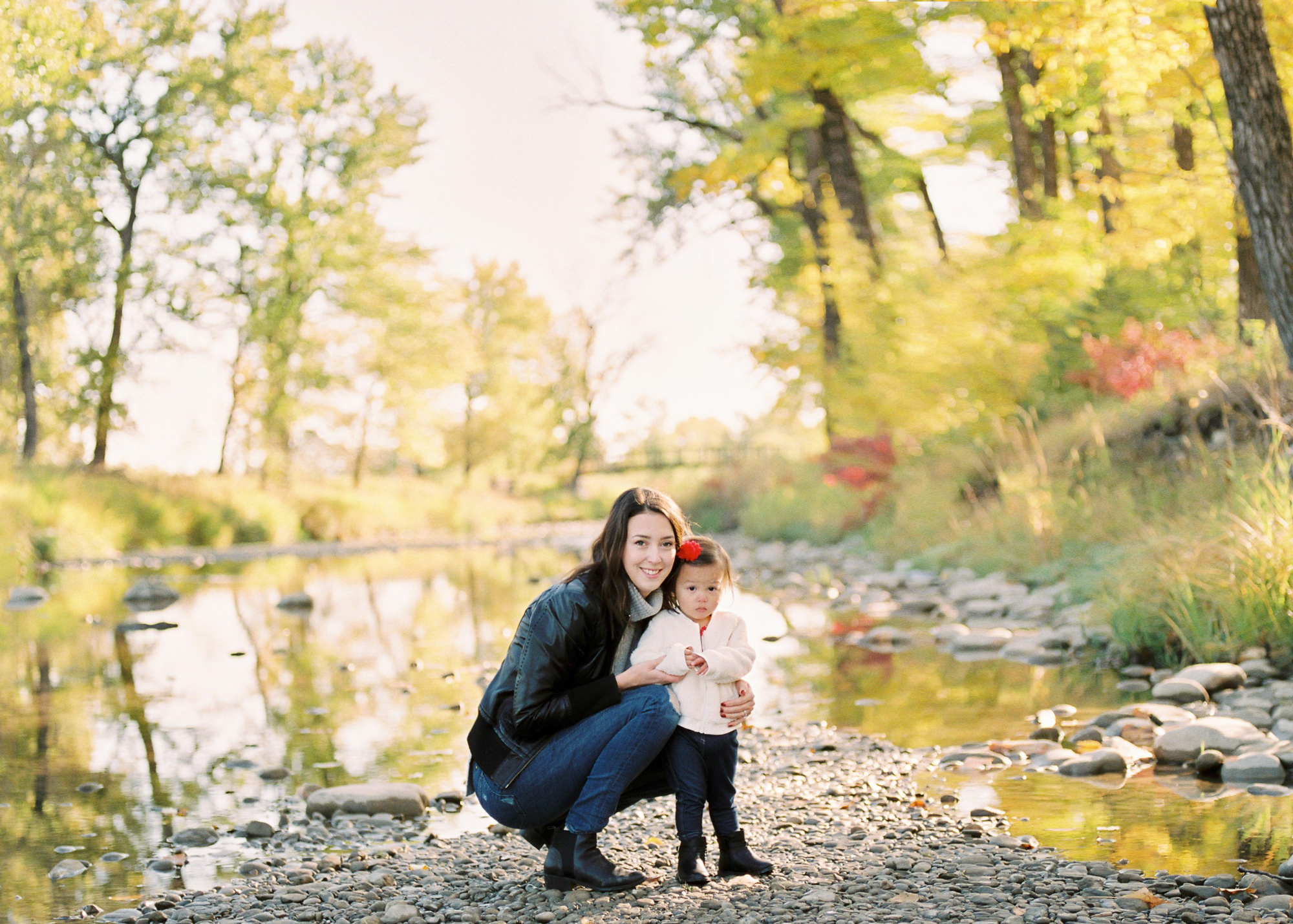 mother and daughter portrait along the river in Calgary's Fish Creek Park